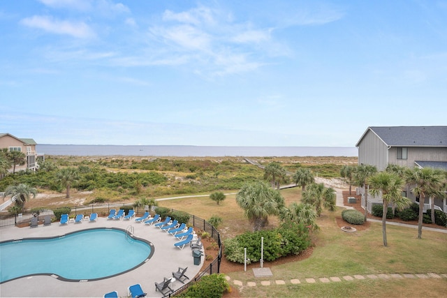 view of swimming pool with a patio and a lawn