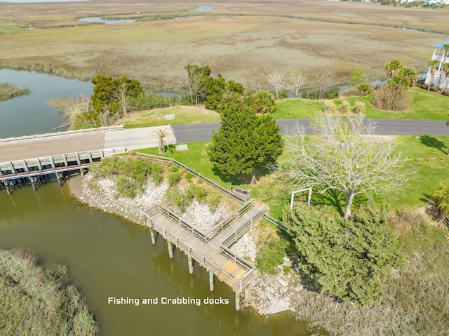 bird's eye view with a water view and a rural view