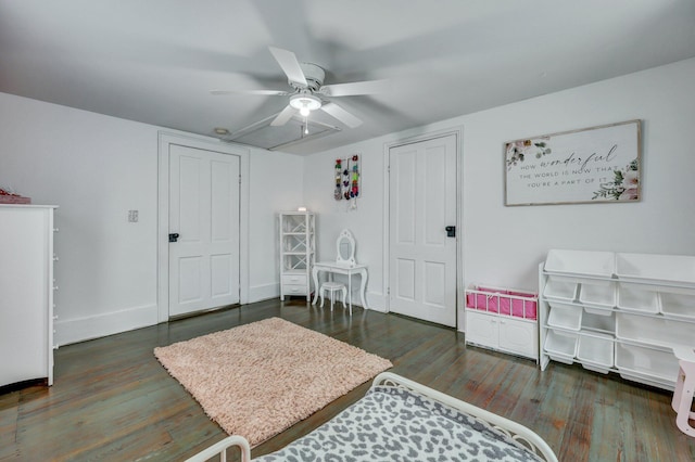 bedroom with baseboards, ceiling fan, and wood finished floors