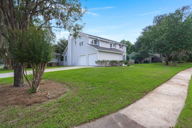 view of side of property with a lawn and a garage