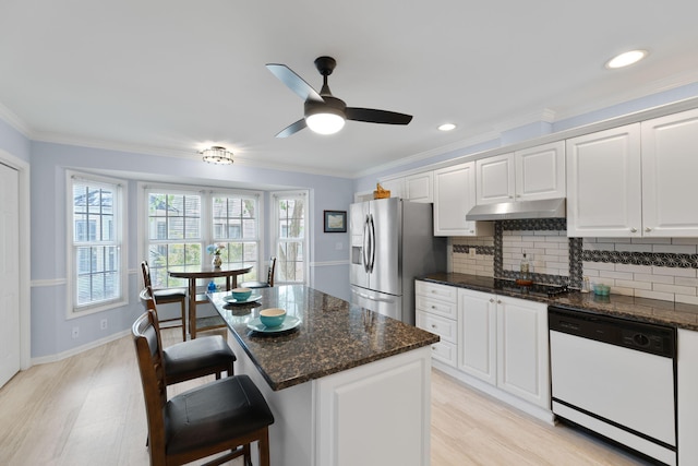 9091 Delancey Cir N, Charleston, SC 29406 - kitchen with dishwasher, stainless steel refrigerator with ice dispenser, a kitchen bar, tasteful backsplash, and white cabinets