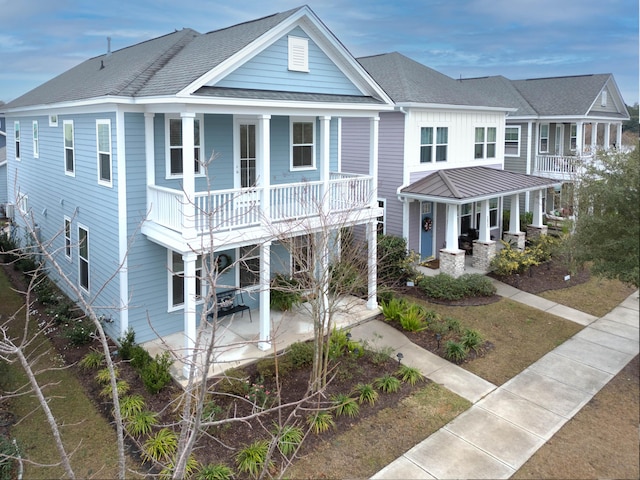 view of front of house with a balcony