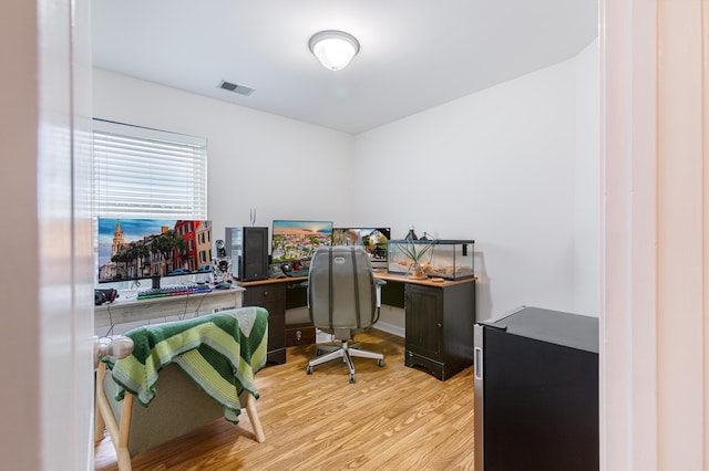 office featuring visible vents and light wood-type flooring
