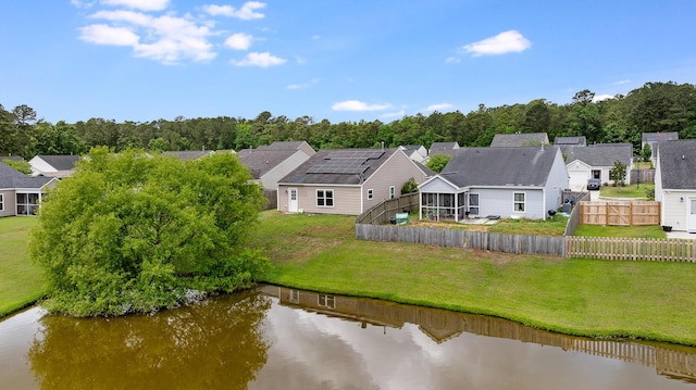 aerial view featuring a water view and a residential view