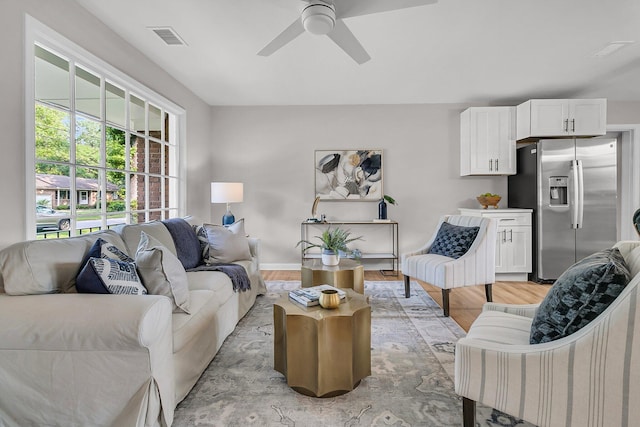 1391 Fairfield Ave, Charleston, SC 29407 - living room with ceiling fan, light wood-style floors, and baseboards