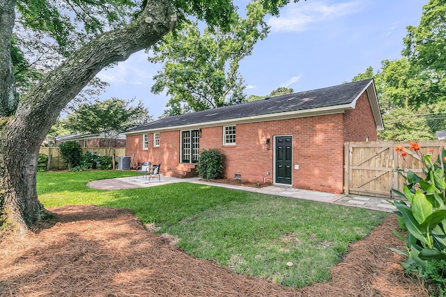 1391 Fairfield Ave, Charleston, SC 29407 - rear view of house featuring brick siding, a patio area, a gate, central air condition unit, and a shingled roof