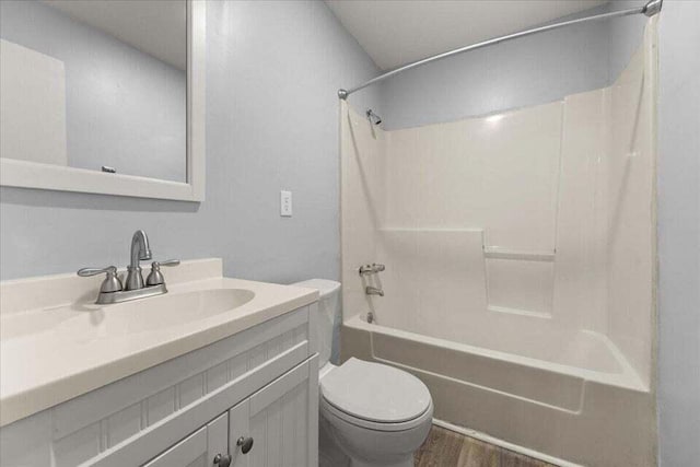 full bathroom featuring vanity, toilet, shower / bath combination, and wood-type flooring