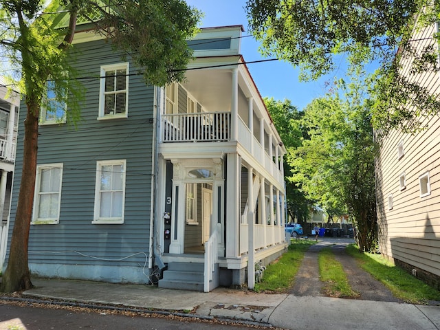 view of home's exterior with a balcony