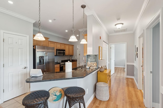 1984 Folly Rd Unit A310, Charleston, SC 29412 - kitchen with appliances with stainless steel finishes, a sink, ornamental molding, recessed lighting, and a peninsula