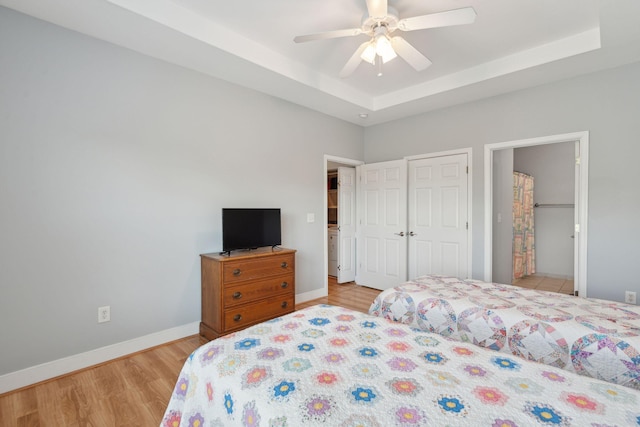 1984 Folly Rd Unit A310, Charleston, SC 29412 - bedroom featuring light wood-style floors, a raised ceiling, ceiling fan, baseboards, and a closet