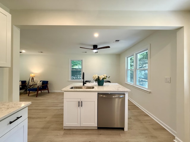 6086 Chisolm Rd, Johns Island, SC 29455 - kitchen featuring a sink, light wood-style flooring, dishwasher, and a wealth of natural light
