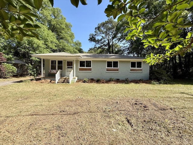 6086 Chisolm Rd, Johns Island, SC 29455 - exterior space with brick siding, a lawn, crawl space, and metal roof