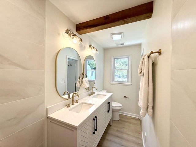 6086 Chisolm Rd, Johns Island, SC 29455 - bathroom with visible vents, a sink, beam ceiling, and wood finished floors