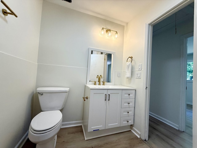 6086 Chisolm Rd, Johns Island, SC 29455 - bathroom featuring vanity, baseboards, toilet, and wood finished floors