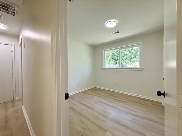 6086 Chisolm Rd, Johns Island, SC 29455 - spare room featuring baseboards, wood finished floors, and visible vents