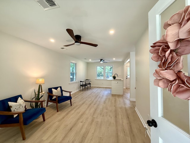 6086 Chisolm Rd, Johns Island, SC 29455 - living area featuring a ceiling fan, visible vents, light wood-type flooring, baseboards, and recessed lighting