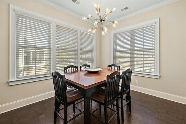 dining room featuring a notable chandelier, visible vents, crown molding, and baseboards