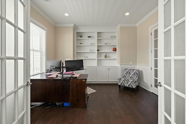 home office with dark wood finished floors, crown molding, built in features, and french doors