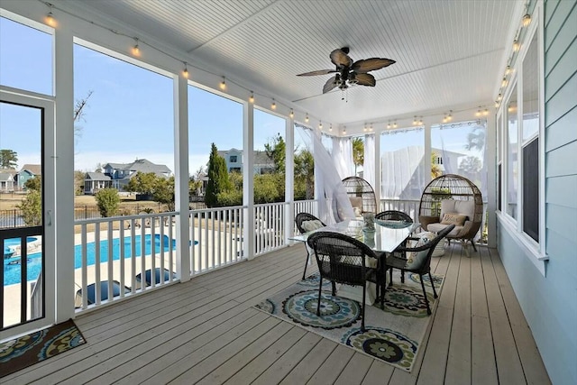 sunroom with a ceiling fan