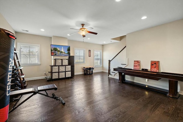 exercise area with visible vents, a healthy amount of sunlight, and wood finished floors