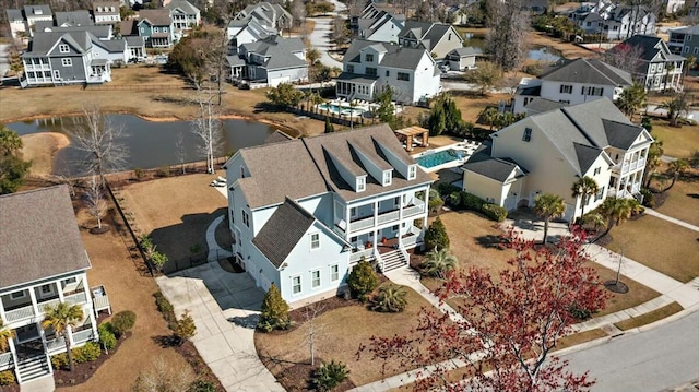 bird's eye view featuring a residential view and a water view