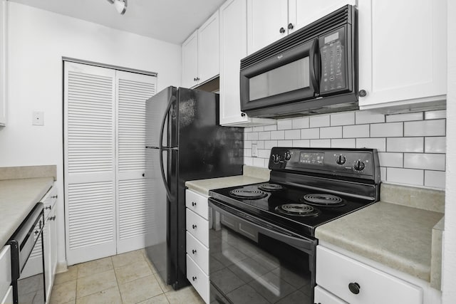 kitchen featuring white cabinetry, light tile patterned floors, decorative backsplash, and black appliances