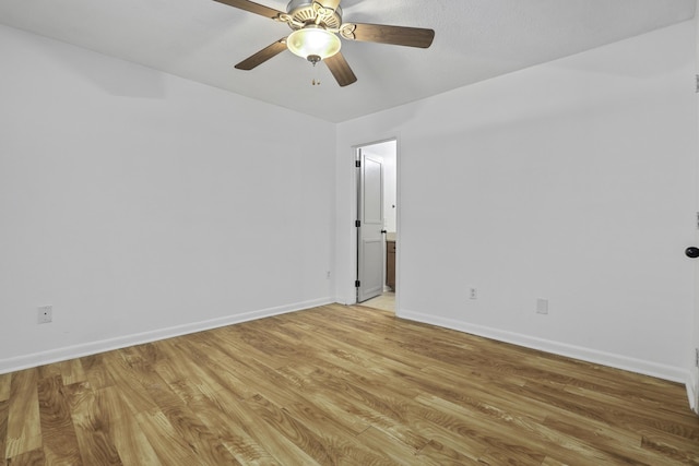 unfurnished room featuring ceiling fan and light wood-type flooring