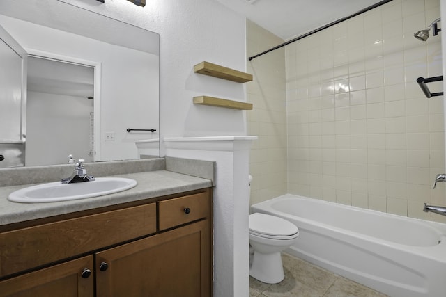 full bathroom with vanity, tiled shower / bath, and toilet