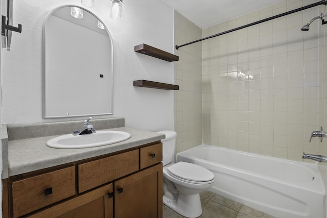 full bathroom featuring vanity, shower / tub combination, tile patterned floors, and toilet