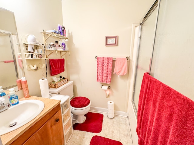 full bathroom featuring toilet, vanity, and shower / bath combination with glass door