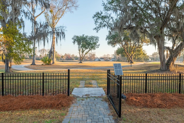 surrounding community featuring fence and a gate