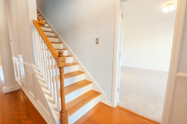 staircase with wood finished floors