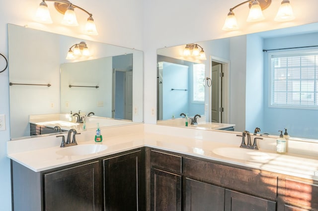 full bath featuring a sink and double vanity