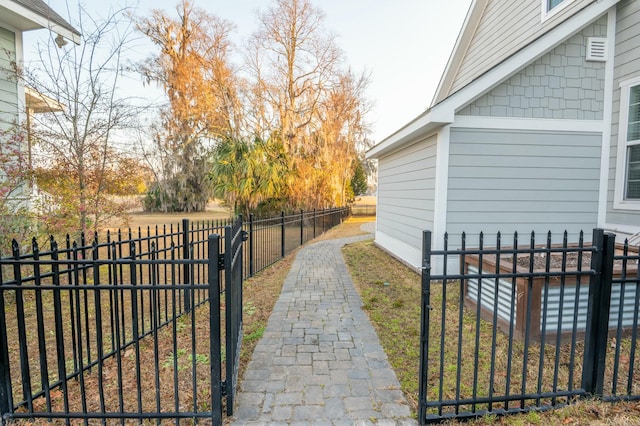 exterior space featuring fence and a gate