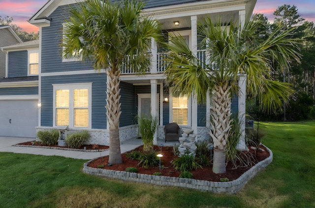 202 Buttercup Ln, Summerville, SC 29486 - view of front of house featuring a porch, a yard, and a garage