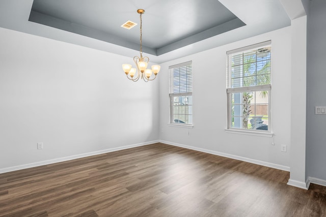202 Buttercup Ln, Summerville, SC 29486 - spare room featuring a tray ceiling, a chandelier, and dark wood-style floors