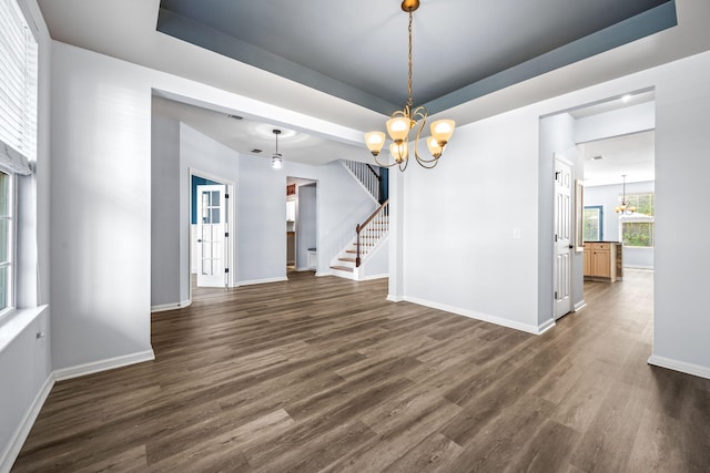 202 Buttercup Ln, Summerville, SC 29486 - empty room with a chandelier, a raised ceiling, dark wood finished floors, and stairway