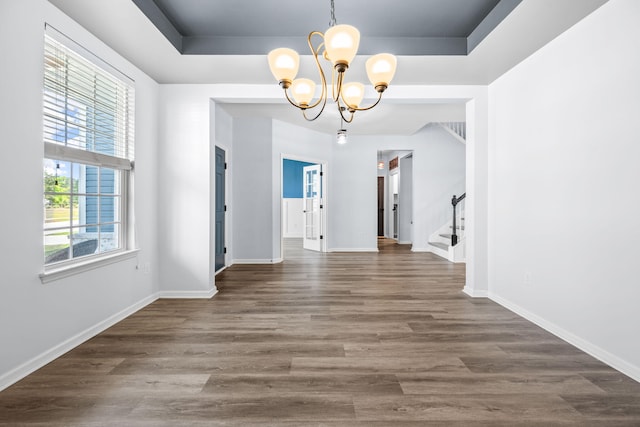 202 Buttercup Ln, Summerville, SC 29486 - unfurnished dining area featuring a chandelier, stairway, dark wood-style flooring, and a tray ceiling