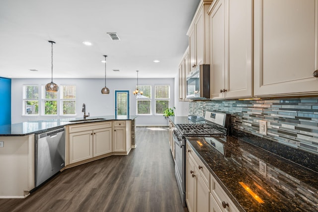 202 Buttercup Ln, Summerville, SC 29486 - kitchen with stainless steel appliances, dark wood-type flooring, tasteful backsplash, a chandelier, and decorative light fixtures