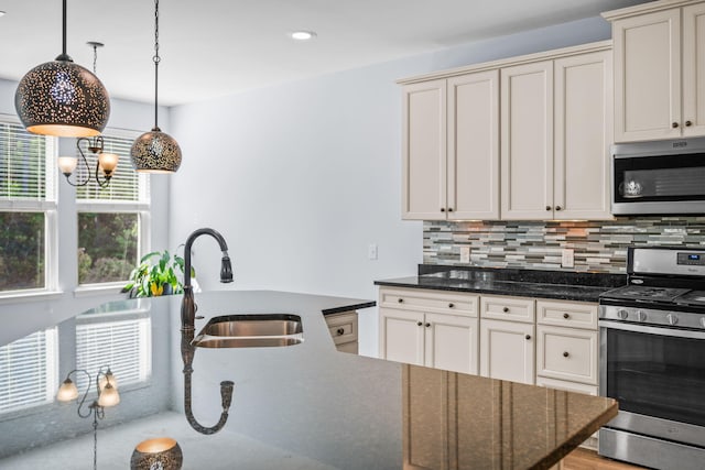 202 Buttercup Ln, Summerville, SC 29486 - kitchen featuring appliances with stainless steel finishes, decorative backsplash, pendant lighting, dark stone countertops, and recessed lighting