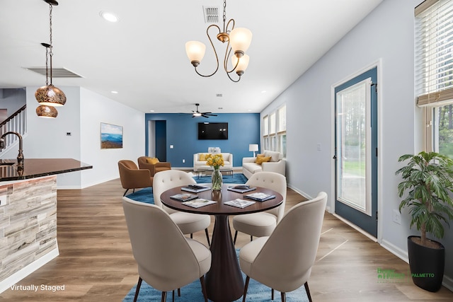 202 Buttercup Ln, Summerville, SC 29486 - dining area featuring healthy amount of natural light, a chandelier, a ceiling fan, wood finished floors, and recessed lighting