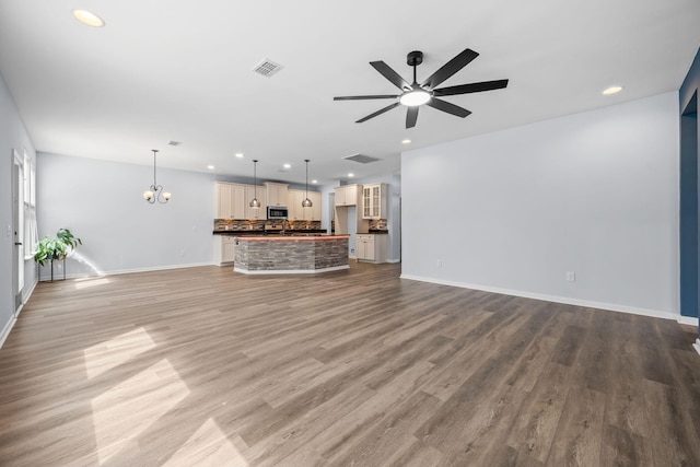 202 Buttercup Ln, Summerville, SC 29486 - unfurnished living room featuring a chandelier, recessed lighting, ceiling fan, and light wood-type flooring