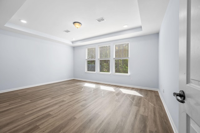 202 Buttercup Ln, Summerville, SC 29486 - unfurnished room featuring a tray ceiling, wood finished floors, and recessed lighting