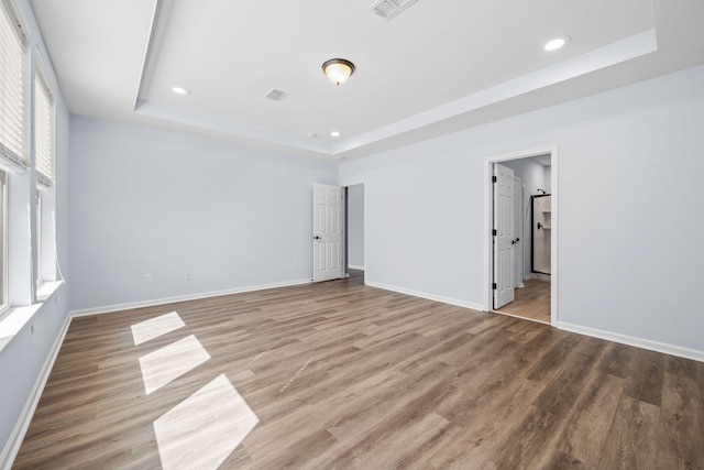 202 Buttercup Ln, Summerville, SC 29486 - unfurnished bedroom featuring a raised ceiling, wood finished floors, and recessed lighting