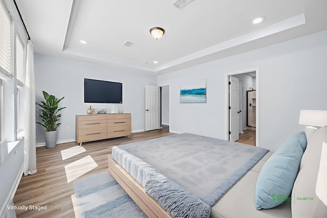 202 Buttercup Ln, Summerville, SC 29486 - bedroom featuring a tray ceiling, recessed lighting, and light wood-style floors