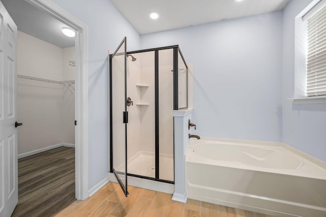 202 Buttercup Ln, Summerville, SC 29486 - full bathroom with a shower stall, a bath, wood finished floors, a walk in closet, and recessed lighting