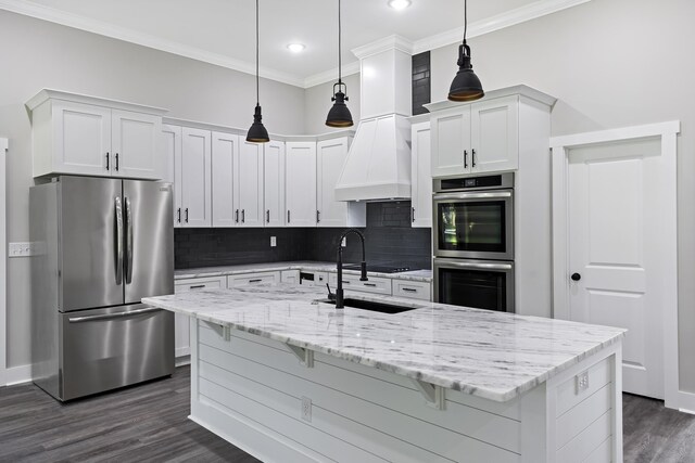 621 Plantation Dr, Santee, SC 29142 - kitchen with white cabinets, dark wood finished floors, crown molding, decorative backsplash, and appliances with stainless steel finishes
