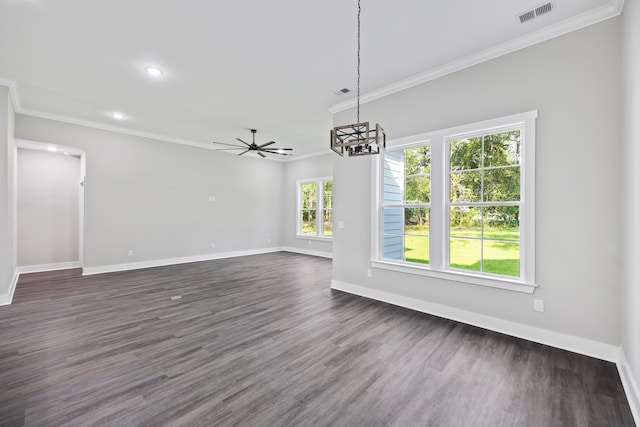 spare room featuring ceiling fan with notable chandelier, dark hardwood / wood-style floors, and crown molding