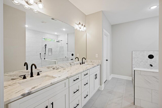 621 Plantation Dr, Santee, SC 29142 - full bath with double vanity, marble finish floor, a walk in shower, and a sink