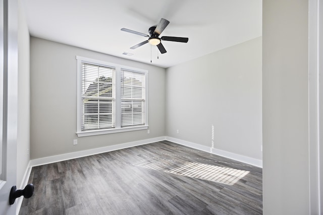 621 Plantation Dr, Santee, SC 29142 - spare room featuring dark wood finished floors, visible vents, baseboards, and ceiling fan